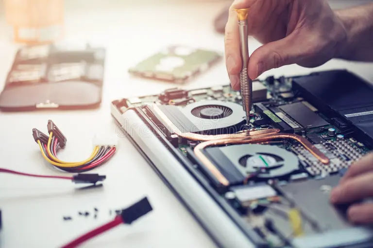 technician-repairing-laptop-computer-closeup-111549038